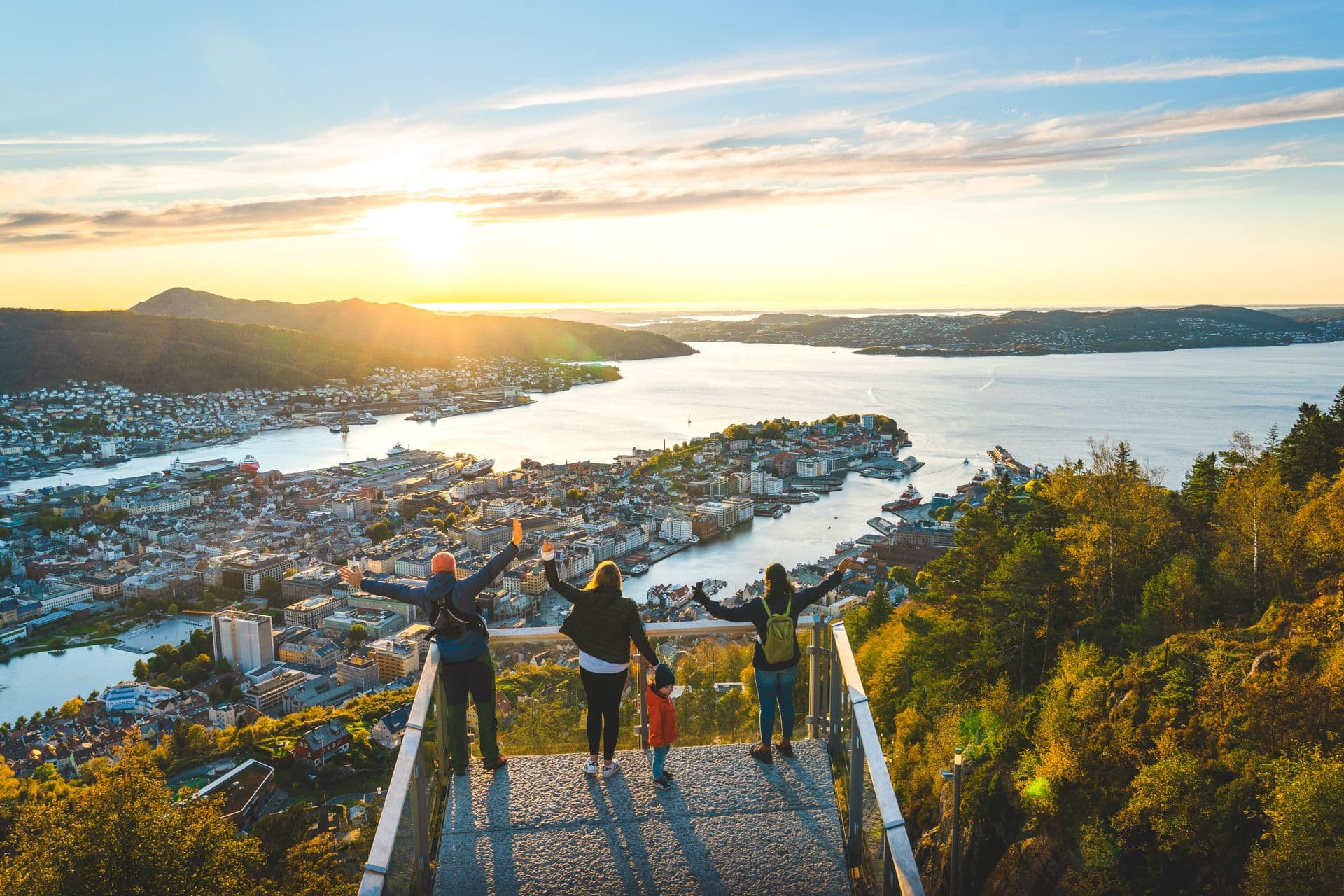 Visitors at Mount Fløyen viewpoint enjoying panoramic views of Bergen city, fjords and surrounding mountains
