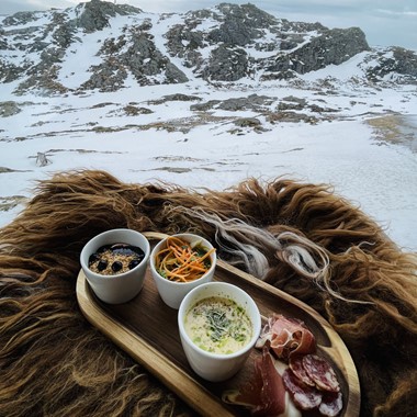 At the top of Mount Ulriken - platter with local food - Activities in Bergen, Norway
